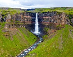 Waterfall cascading down rugged cliffs