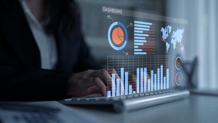 A business professional engages with a holographic dashboard that showcases data analytics, featuring various charts, graphs, and a world map in an office setting. Impute