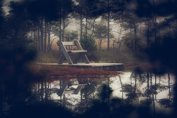 Wooden bench at the lake side