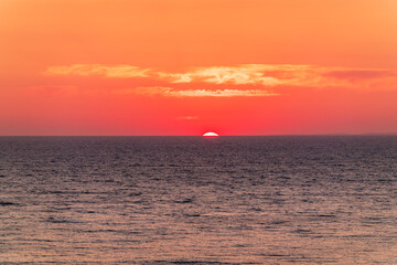 Beautiful red and orange sunrise over the sea.