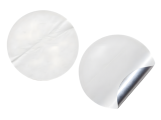 Two round white stickers, one peeled back to reveal a silver backing, isolated on transparent background