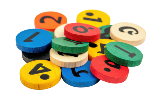 Colorful assortment of wooden tokens featuring numbers and shapes scattered on a white surface