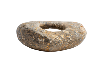 Unique stone artifact with a central hole, showcasing natural texture and organic shapes
