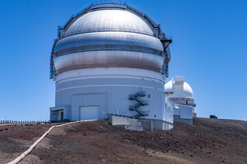 Fototapeta premium The Gemini Observatory comprises two 8.1-metre (26.6 ft) telescopes, Gemini North and Gemini South, situated in Hawaii and Chile. Top of Mauna Kea, Hawaii island / Big island.