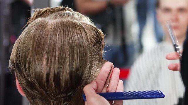 Barber or Hairdresser Cutting Short Hair on the Back of the Head. Close-up Haircut