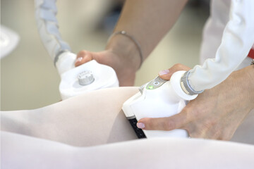 Close-up of Anti-Cellulite or Body Contouring Massage with a Specialized Machine on Leg