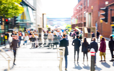 Obraz premium Motion blur of people walking in the City of London at sunny day.