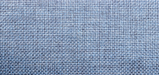 Blue textured fabric close-up shot, ideal for backgrounds, design, or textile applications. The weave pattern adds depth and dimension, suitable for various creative projects.