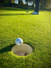 golf ball on the hole