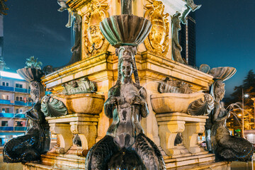 Batumi, Adjara, Georgia. Decorative Details Of Neptune Fountain In Park On Rustaveli Ave. Famous Landmark In Night Illumination