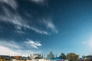 Taj Mahal In Agra, Uttar Pradesh, India. Night view Of Taj Mahal. Seven World Wonders. Night stars above Fabulous Taj Mahal Travel Concept. Indian Islamic Heritage At Night Time