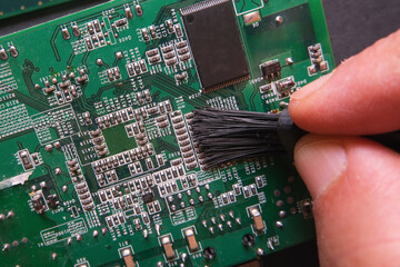 Maintenance of electronic systems. Cleaning the dust on the surface semiconductor components of digital devices. 