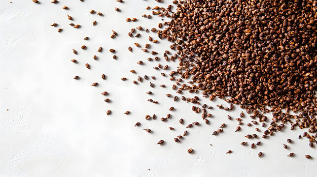 Nigella seeds spread out on a flat white surface, each one displaying its fine details, with natural lighting highlighting the texture.