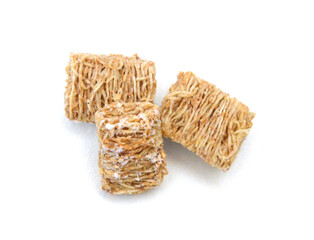 Breakfast setting with frosted wheat cereal on white background 