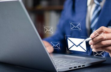 Email marketing concept, company sending many e-mails or digital newsletter to customers. Businessman use laptop to send bulk documents via email. Direct selling projects in business List of customers