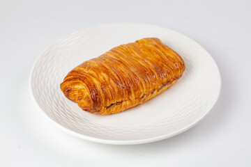 Crispy layered pastry on white plate - perfect breakfast or snack