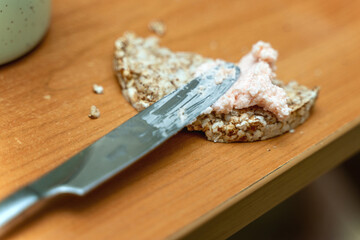 Rye crispbread with caviar and butter spread, served with table knife, ideal for gourmet food photography and culinary blogs