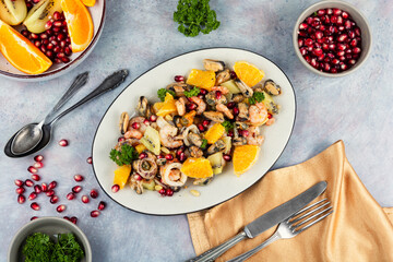 Appetizing salad of seafood and citrus fruits. © nikolaydonetsk