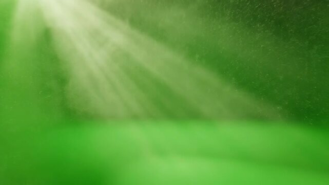 Cinematic wide shot of dusty, hazy light rays gently falling and scattering through a green screen environment, evoking a nostalgic mood volumetric, studio shot, nostalgic mood