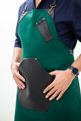 Man in green apron with leather pocket - style, practicality and professional look