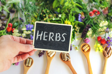 Various medicinal herbs and flowers and supplements. Selective focus.