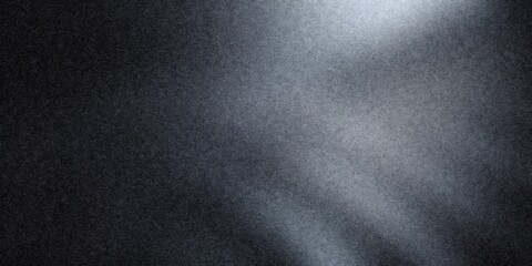 Dark grainy texture background reflecting light, abstract shimmering speckled surface with noise and dappled shadows