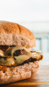 A juicy double patty smash burger, dripping with melted cheese, homemade barbecue sauce, and luxurious truffle mayo. A gourmet take on a classic American comfort food.