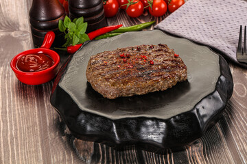 Grilled beef burger cutlet with sauce