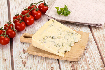Blue cheese with mold over board
