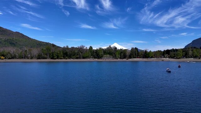 4K Drone Footage Flying Low Over a Lake and Rising Toward Villarrica Volcano

