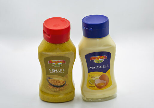 Delizie del Sole mustard and mayonnaise condiment bottles closeup.