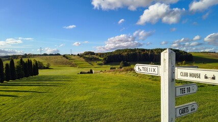 golf course with sign on a beautiful autumn day
