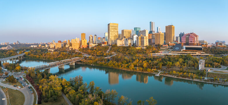 Panoramic sunrise aerial of Edmonton skyline and river valley, Alberta