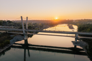 Aerial sunrise view of Tawatina Bridge and Edmonton skyline, Alberta