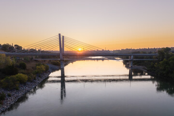 Aerial sunrise view of Tawatina Bridge and Edmonton skyline, Alberta