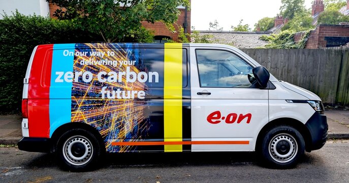 Leicester, England, UK - 29 May 2025: E.ON delivery van parked on a residential street with bold branding wrap promoting a "zero carbon future"