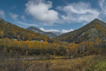 Russia. Western Siberia, Altai Mountains. A fascinating view of the autumn Altai mountains sprinkled with the first snow in the valley of the Chuya River.