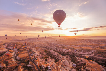 beautiful inspiring landscape with hot air balloons at sunrise in Cappadocia, Turkey © Song_about_summer