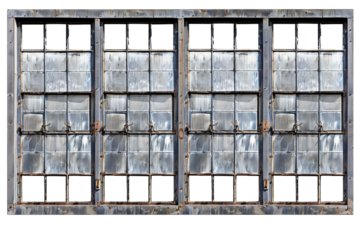 Rustic charm of an old factory window with four panes reflecting light on a sunny day