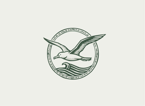 Elegant emblem featuring a seagull soaring above ocean waves, perfect for coastal brands and nautical themes, evoking freedom and serenity with classic design