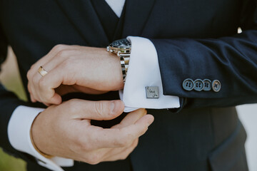 Groom Adjusting Cufflinks Before Wedding Ceremony