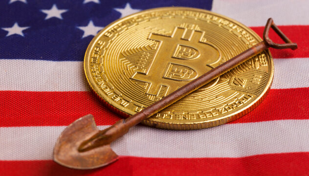 A Bitcoin coin on the US flag and a spoon - Powered by Adobe