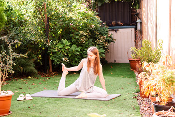 Teenage Girl Stretching Outdoors in Backyard. Morning Fitness and Healthy Lifestyle
