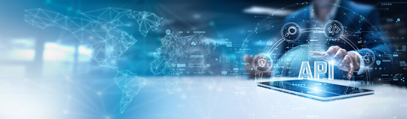 Businessman using tab and analysis API data. system integration services, standardized communication protocols, REST-based applications, JSON data exchange, interoperable development tools