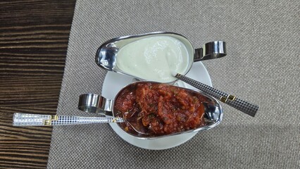 Traditional georgian cuisine - tasty dips on rustic table setting. Top view