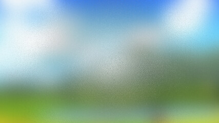 Abstract blurred background with blue sky and meadow