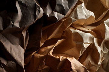 Macro view of crumpled overlapping sheets in earthy tones
