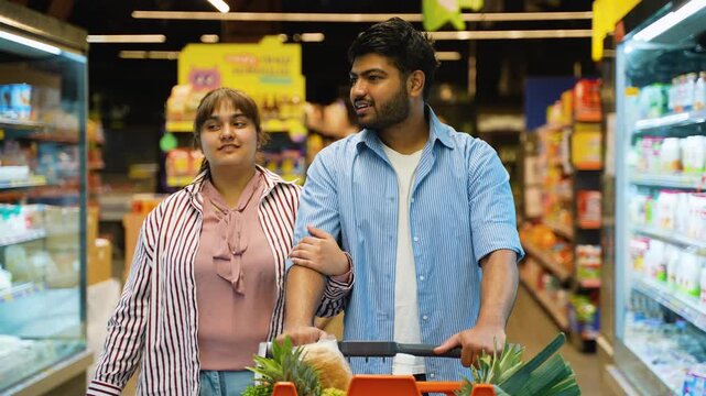 Young Pakistani couple shopping for groceries together