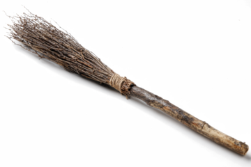 Rustic broom made of twigs and branches tied with twine isolated on white background perfect for Halloween or cleaning concepts