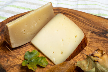 Pieces of hard matured Italian cheese pecorino made from sheep's milk